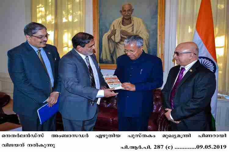 Chief Minister Pinarayi Vijayan receiving the book of Netherlands Ambassador